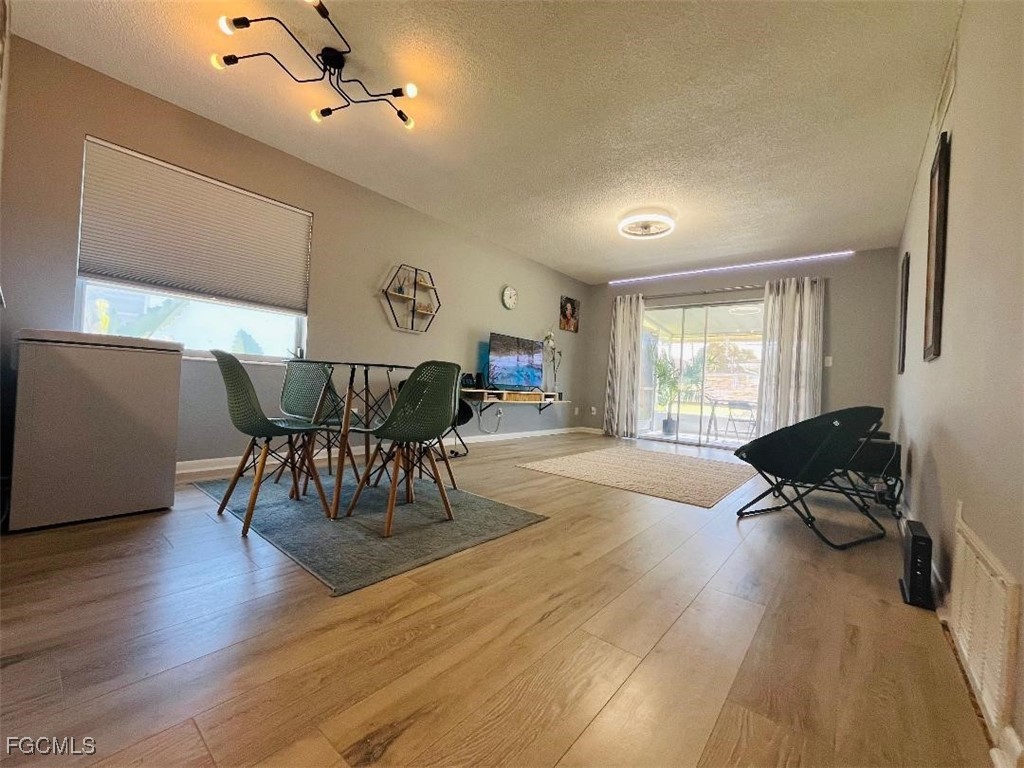 2210 Croton Court Lehigh Acres, FL 33936 - Photo 6 of 13 a living room with furniture and a large window