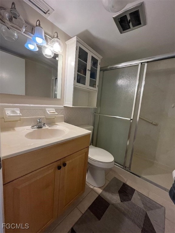 2210 Croton Court Lehigh Acres, FL 33936 - Photo 7 of 13 a bathroom with a sink toilet and shower