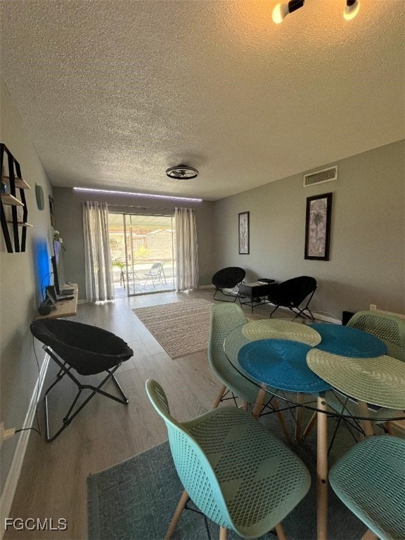 2210 Croton Court Lehigh Acres, FL 33936 - Photo 10 of 13 a living room with furniture and a table