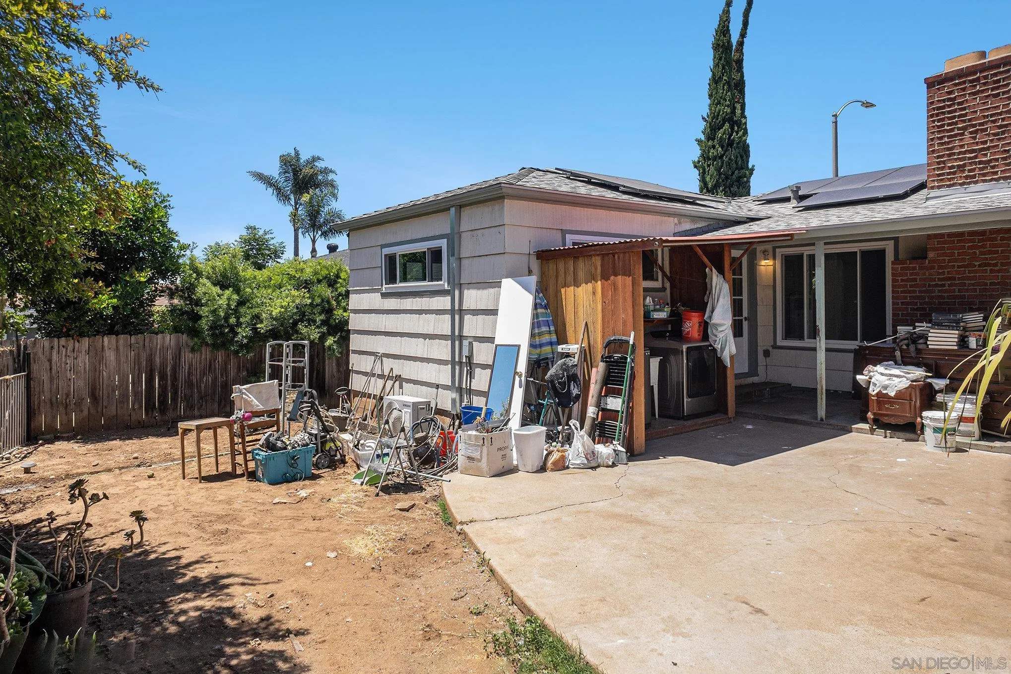 74 E Street Chula Vista, CA 91910 - Photo 13 of 56 a view of a patio with a table and chairs under an umbrella