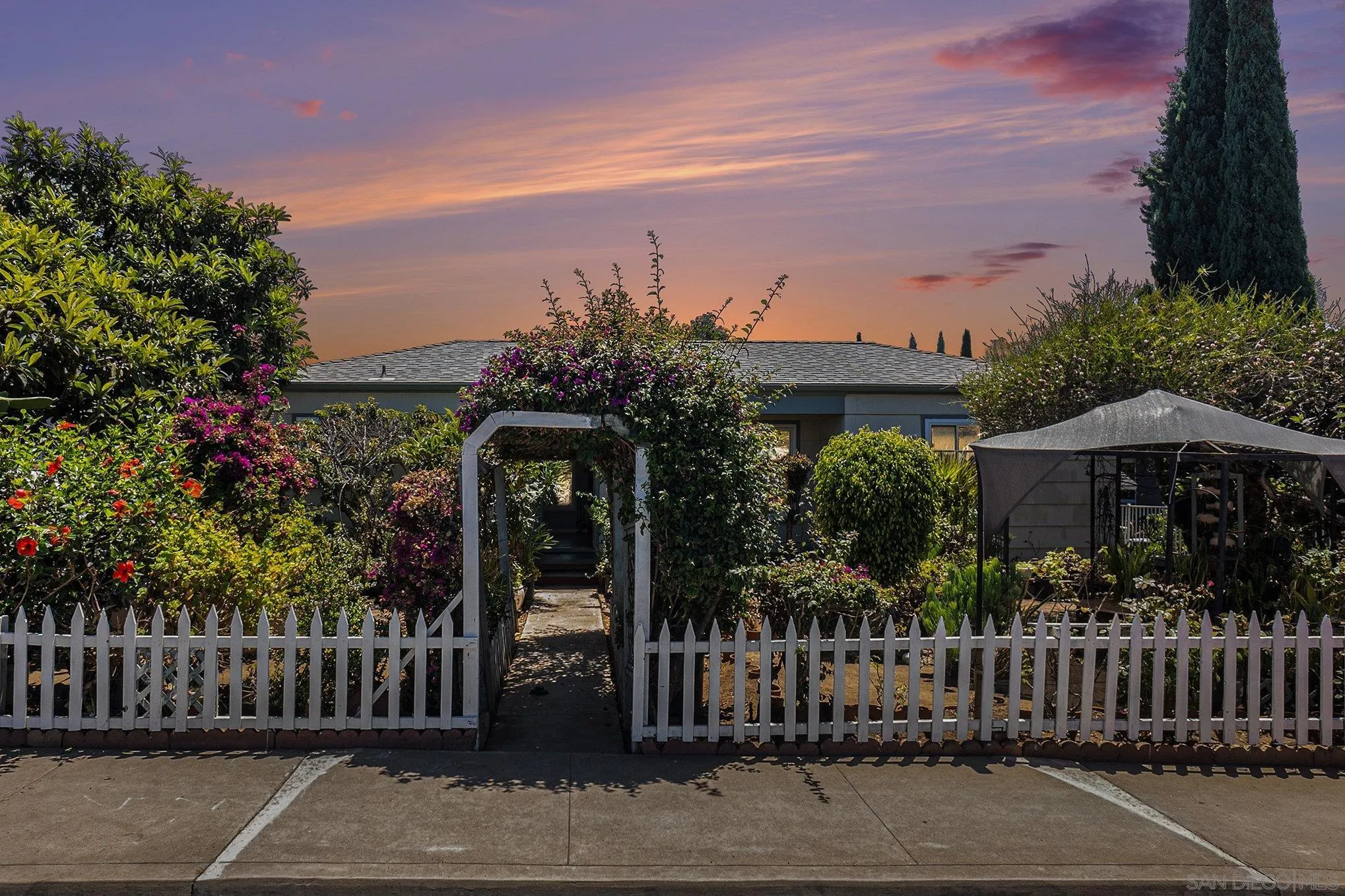 74 E Street Chula Vista, CA 91910 - Photo 2 of 56 a front view of a house with plants