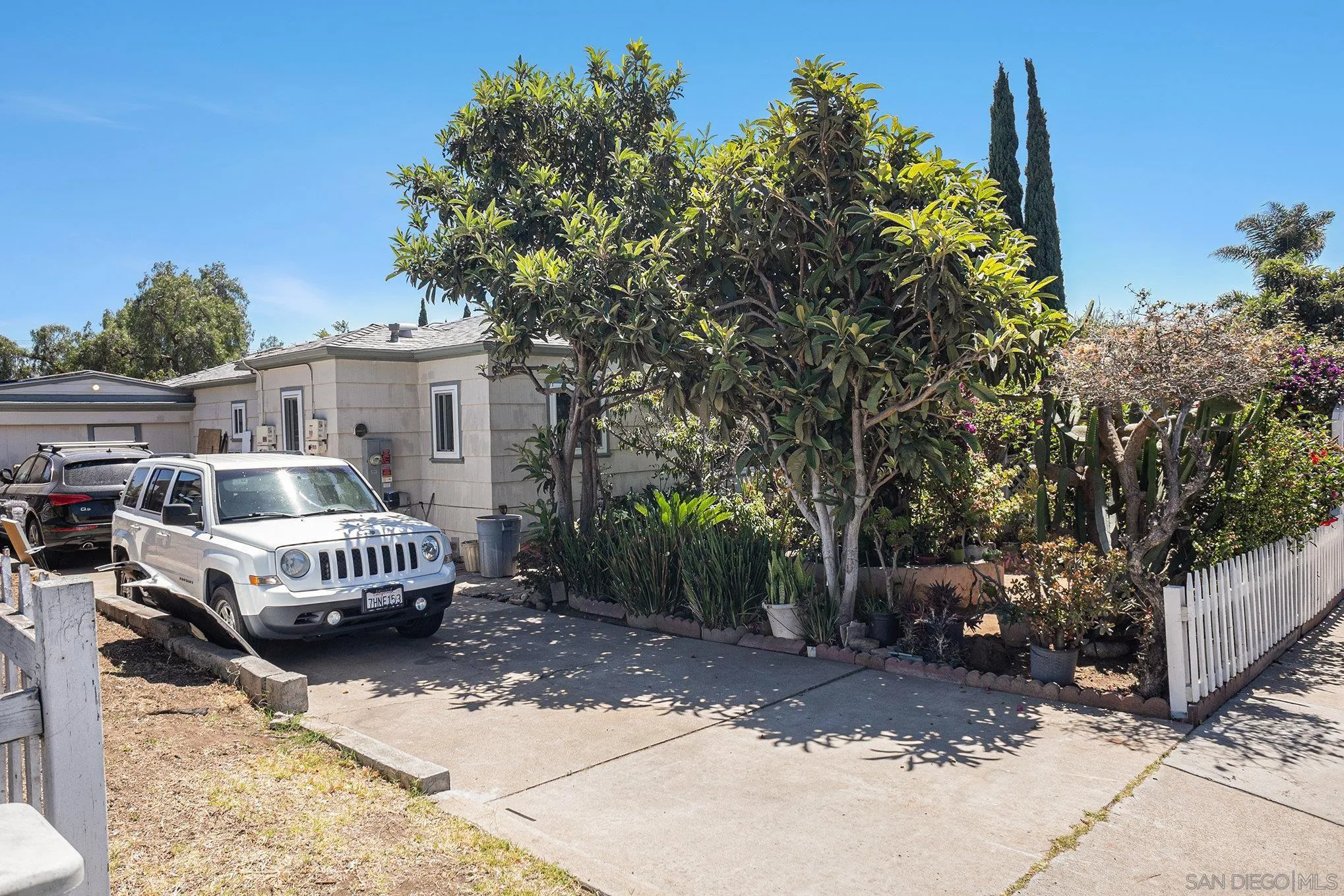 74 E Street Chula Vista, CA 91910 - Photo 24 of 56 a front view of a house with a yard