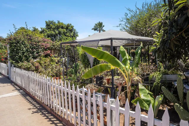 a view of a backyard with table and chairs