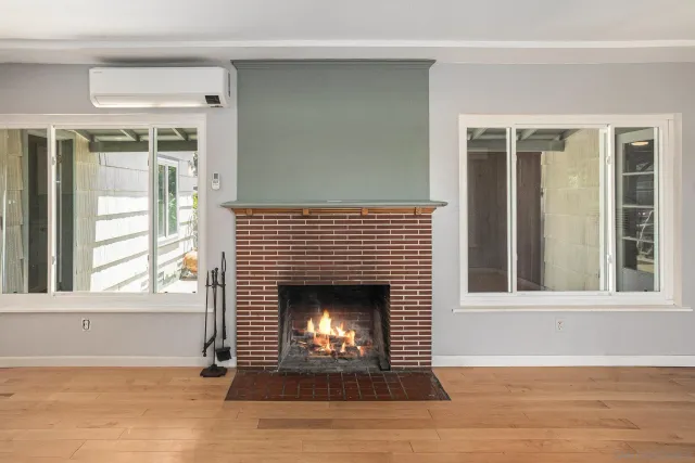 a large kitchen with a large window and stainless steel appliances