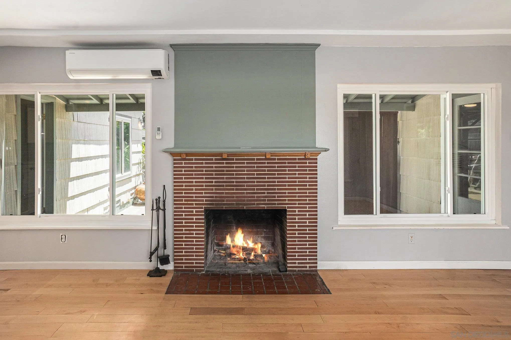 74 E Street Chula Vista, CA 91910 - Photo 36 of 56 a view of an empty room with wooden floor and a window