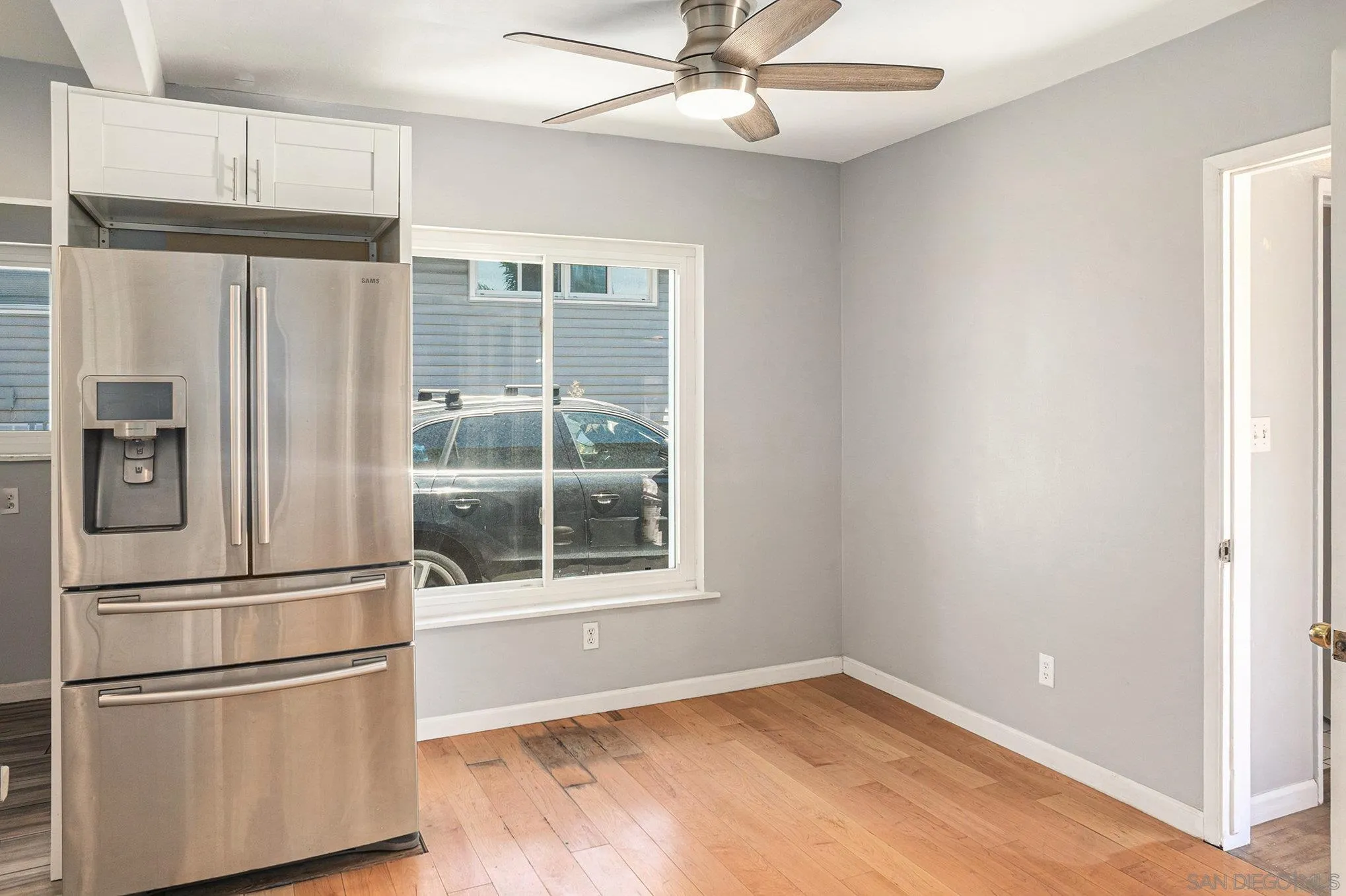 74 E Street Chula Vista, CA 91910 - Photo 43 of 56 a view of empty room with wooden floor and fan