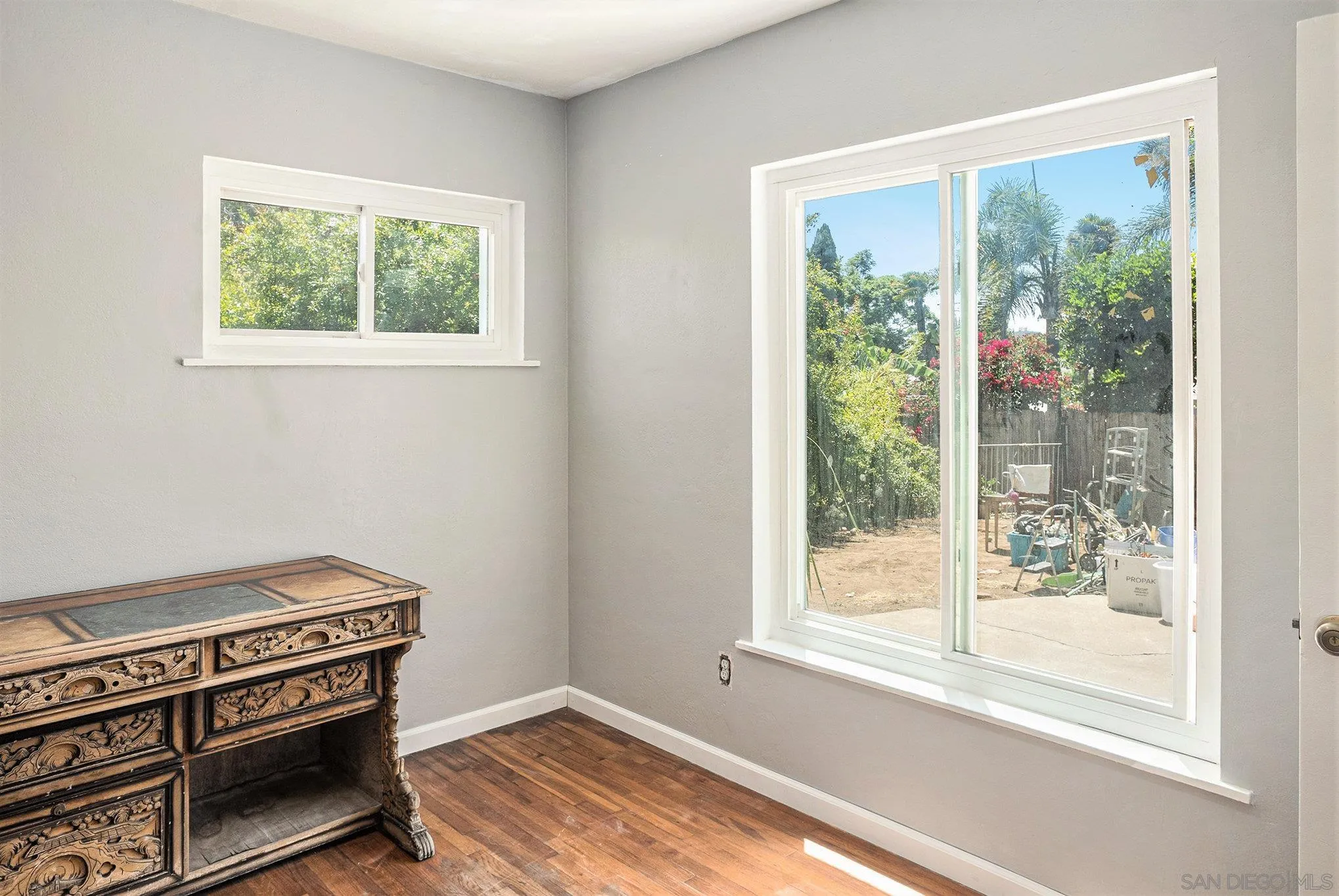 74 E Street Chula Vista, CA 91910 - Photo 45 of 56 a view of an empty room with wooden floor and a window