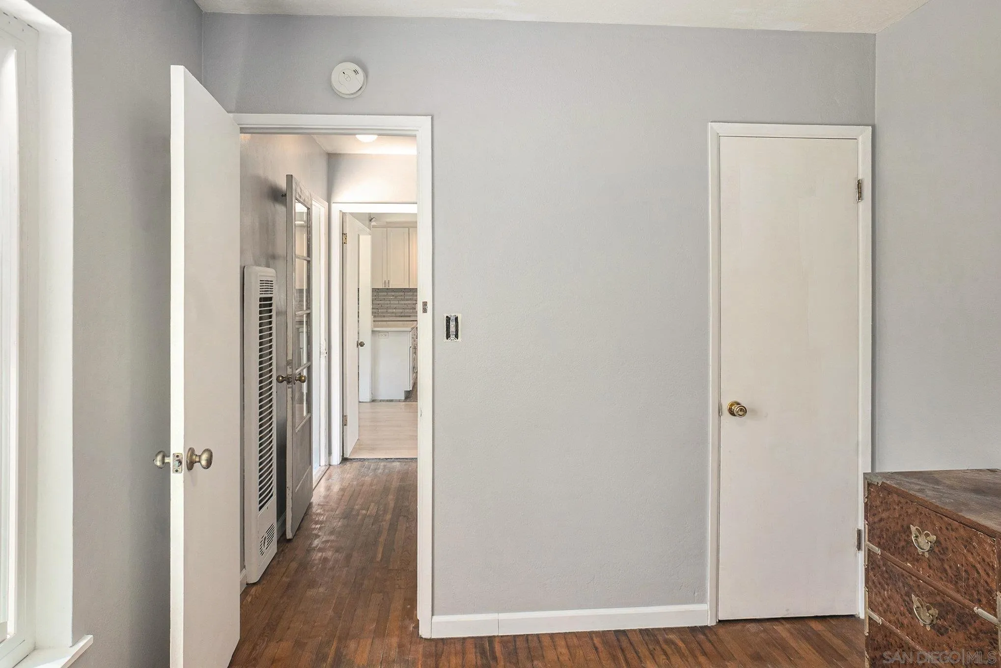 74 E Street Chula Vista, CA 91910 - Photo 46 of 56 a view of a hallway with wooden floor