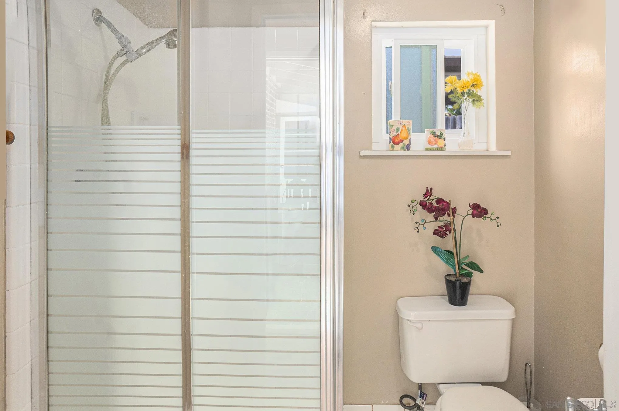 74 E Street Chula Vista, CA 91910 - Photo 47 of 56 a bathroom with a sink mirror and toilet