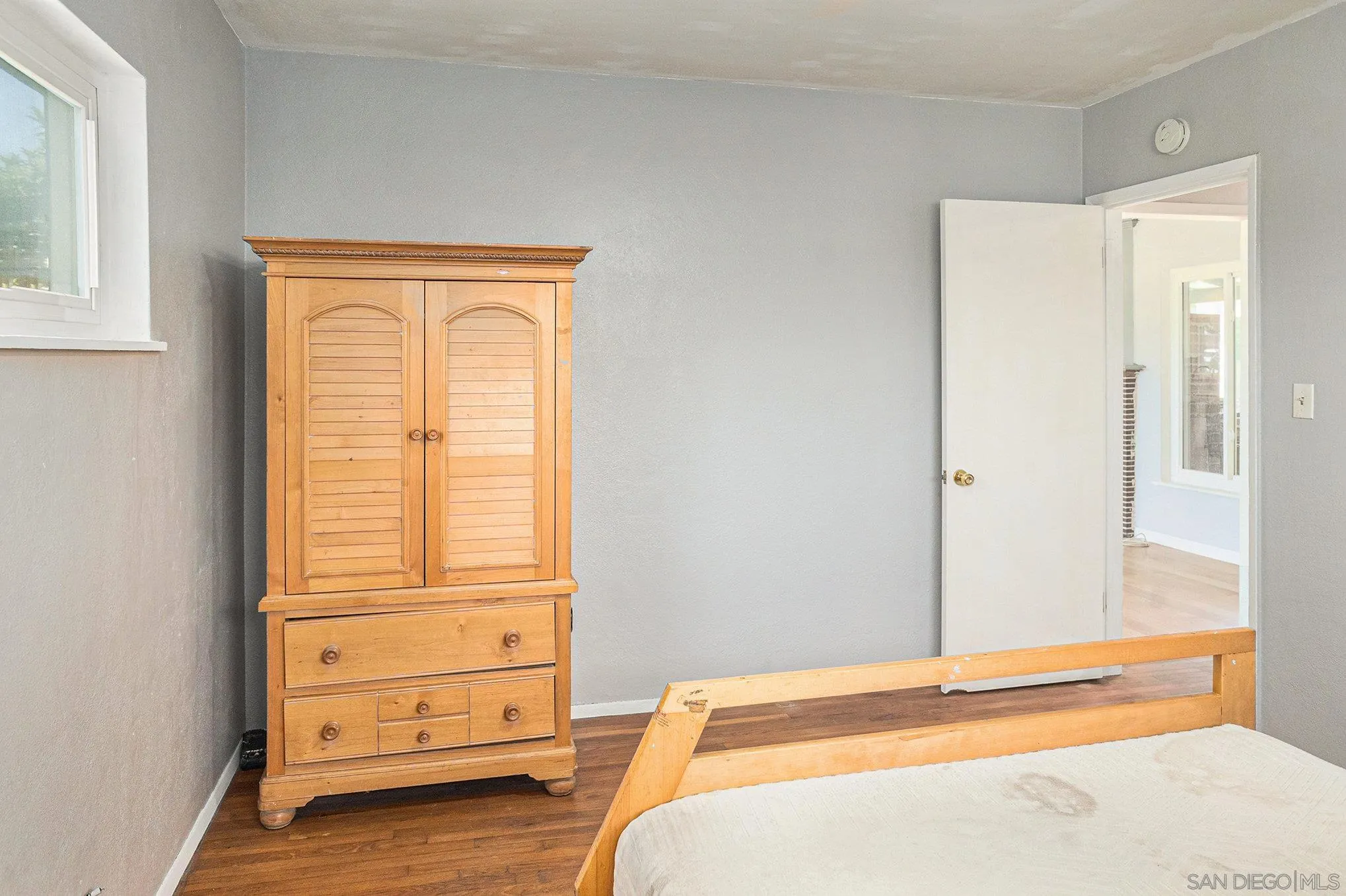 74 E Street Chula Vista, CA 91910 - Photo 49 of 56 a bedroom with a bed and a dresser