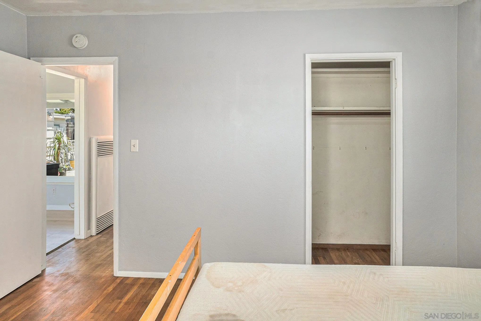 74 E Street Chula Vista, CA 91910 - Photo 50 of 56 a bedroom with wooden floor and a bathroom