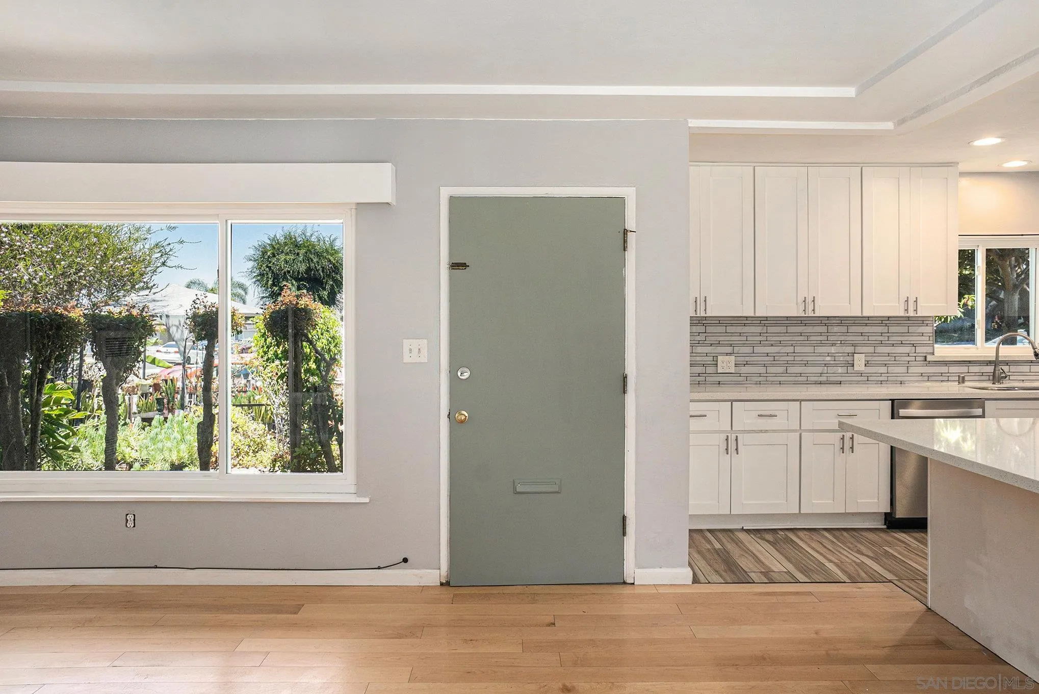 74 E Street Chula Vista, CA 91910 - Photo 9 of 56 a view of kitchen with wooden floor and electronic appliances