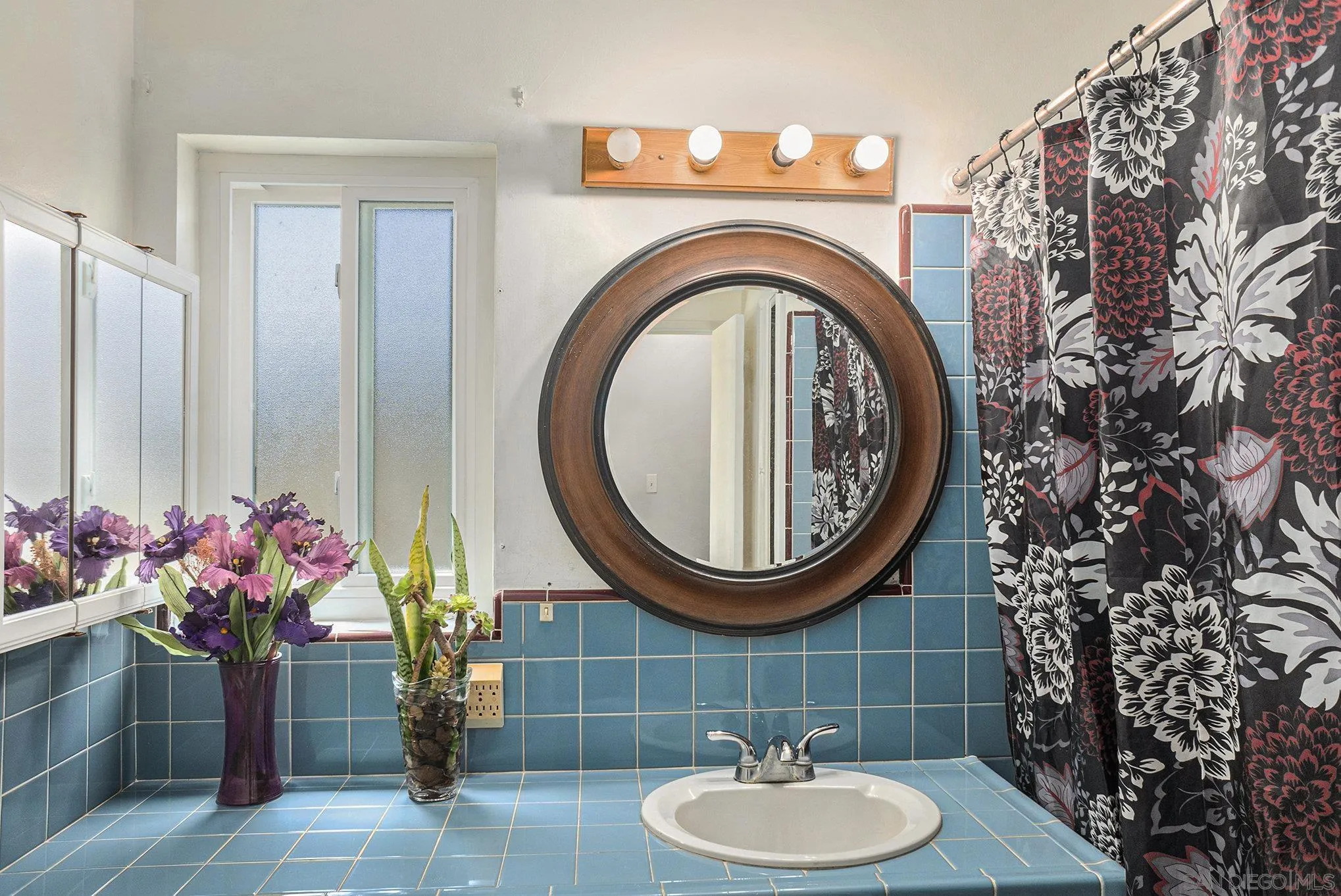 74 E Street Chula Vista, CA 91910 - Photo 10 of 56 a bathroom with a sink mirror and toilet