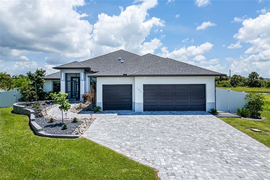 a front view of house with yard and outdoor seating