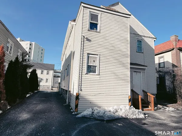 a view of a house with a street