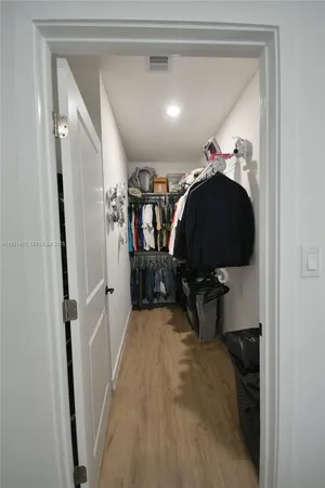 a bathroom with a double vanity sink toilet and mirror