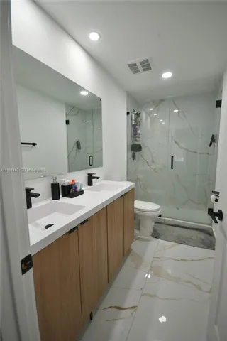 a view of a bathroom with wooden floor