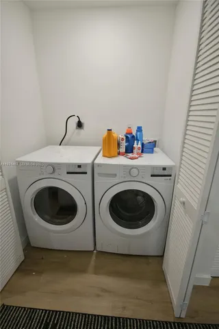 a bathroom with a tub sink toilet and a mirror