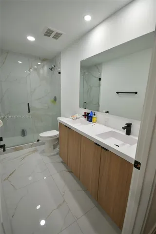 a kitchen with a sink and a refrigerator