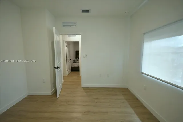 a bedroom with a bed and dresser