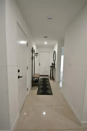 a view of hallway with a large window