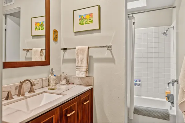 a bedroom with a bed and a couch