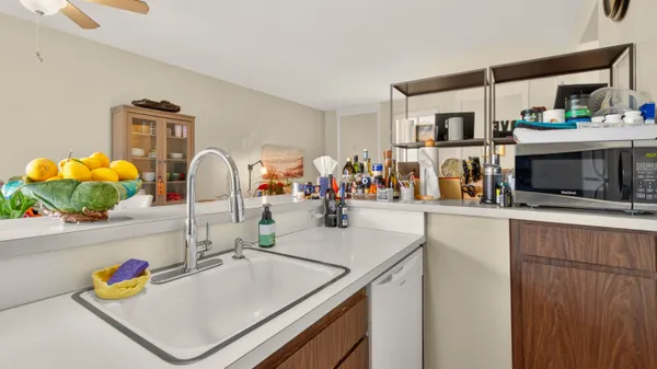 a outdoor dining space with furniture and potted plants