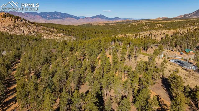 a view of an ocean and a mountain