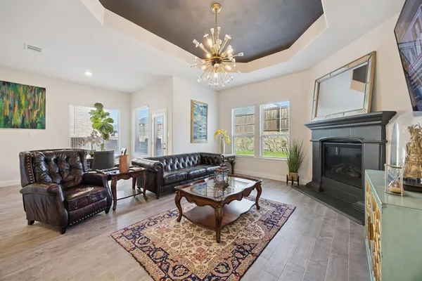 a living room with furniture and a fireplace