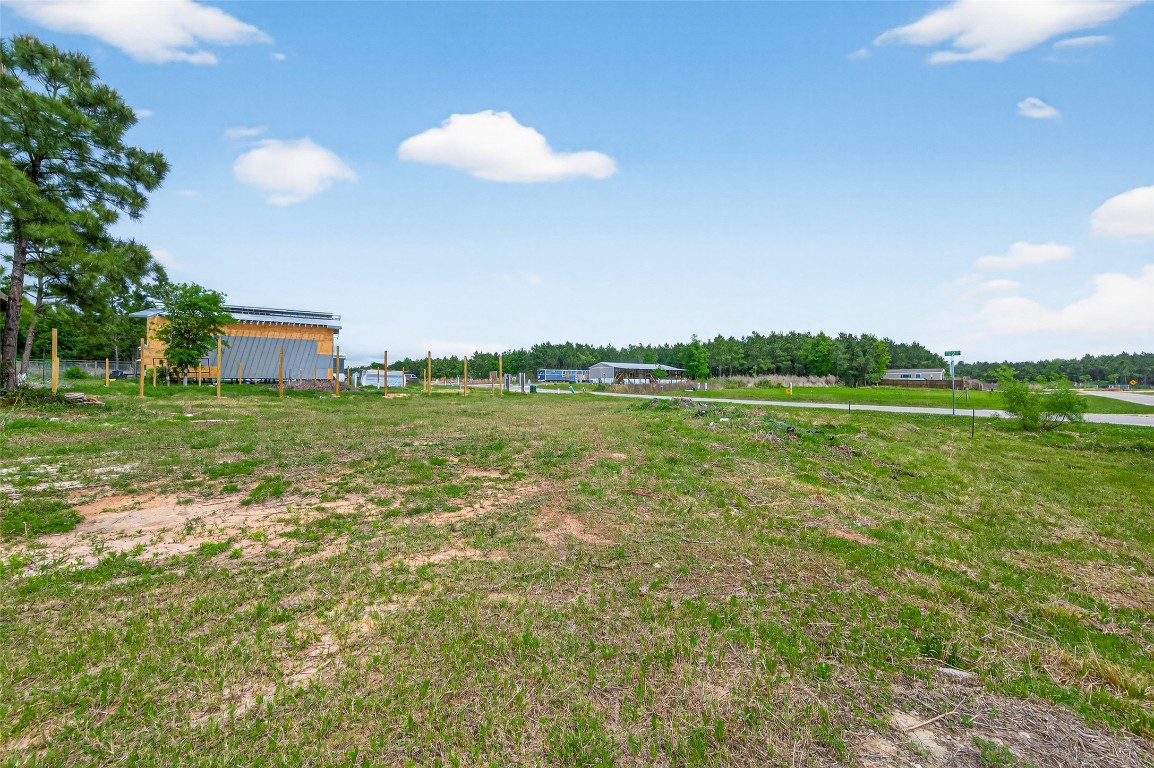 159 Road 5814 Cleveland, TX 77327 - Photo 7 of 12 a view of a golf course with a lake