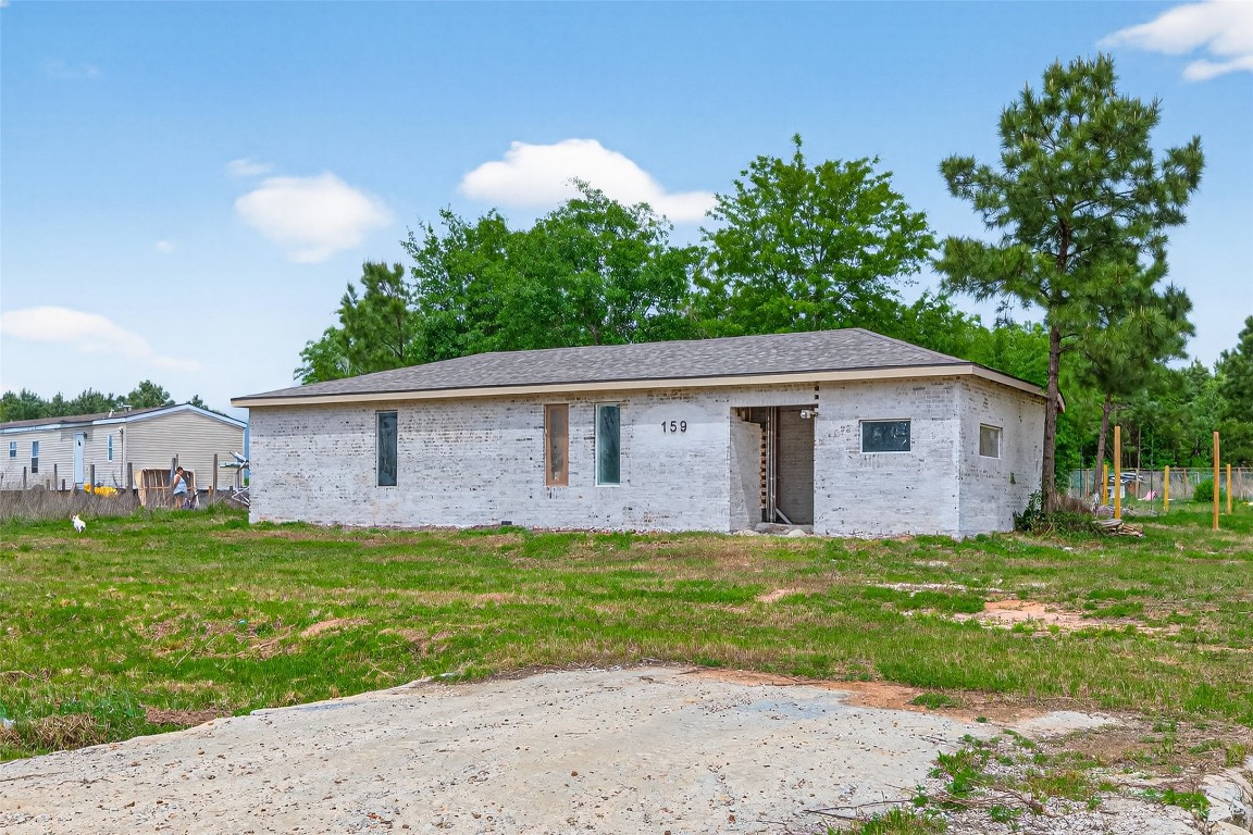 159 Road 5814 Cleveland, TX 77327 - Photo 9 of 12 a backyard of a house