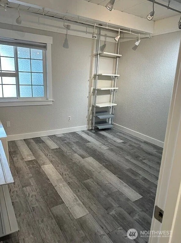 118 4th Avenue Southeast, Unit 118 Puyallup, WA 98372 - Photo 14 of 14 a view of a room with rack on the wall
