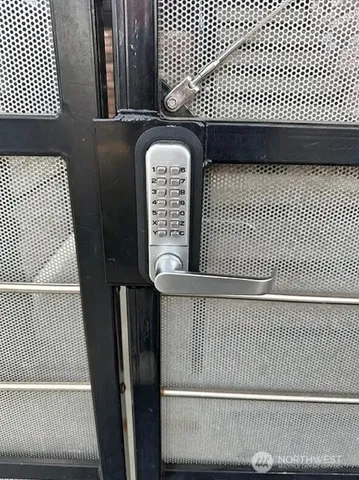 a view of a brick wall with wooden floor