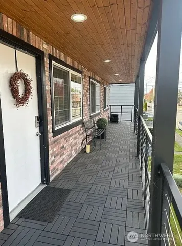 a lobby with furniture and floor to ceiling window