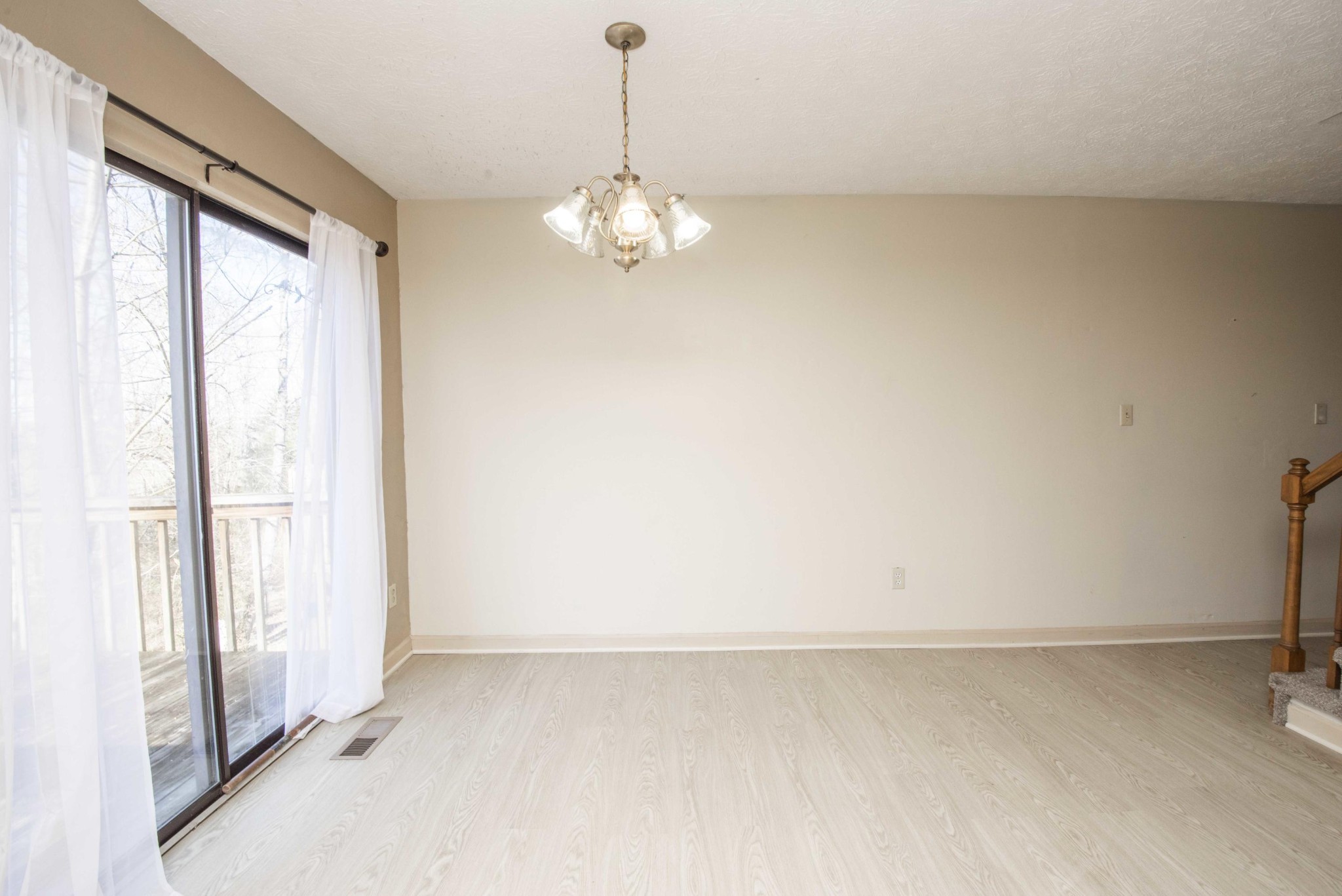 149 High Point Lane Oak Ridge, TN 37830 - Photo 4 of 27 a view of empty room with wooden floor and fan