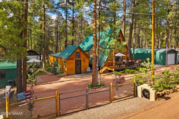 a view of house with outdoor space and porch
