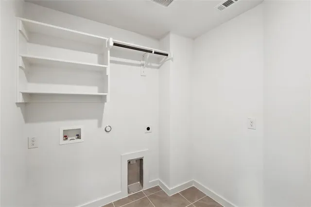 a view of a kitchen with a sink and a chandelier fan