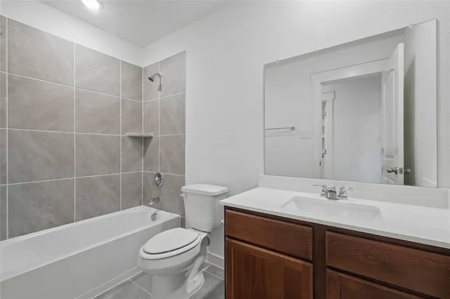 a view of an empty room and closet area