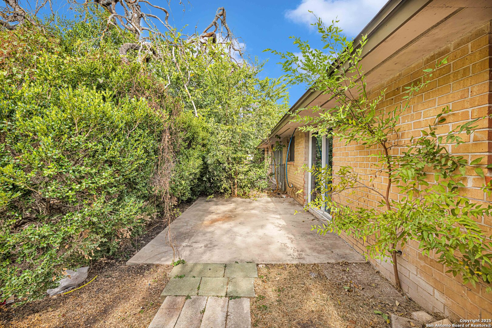 6012 Evers Road Leon Valley, TX 78238 - Photo 15 of 17 a pathway of a house with a yard