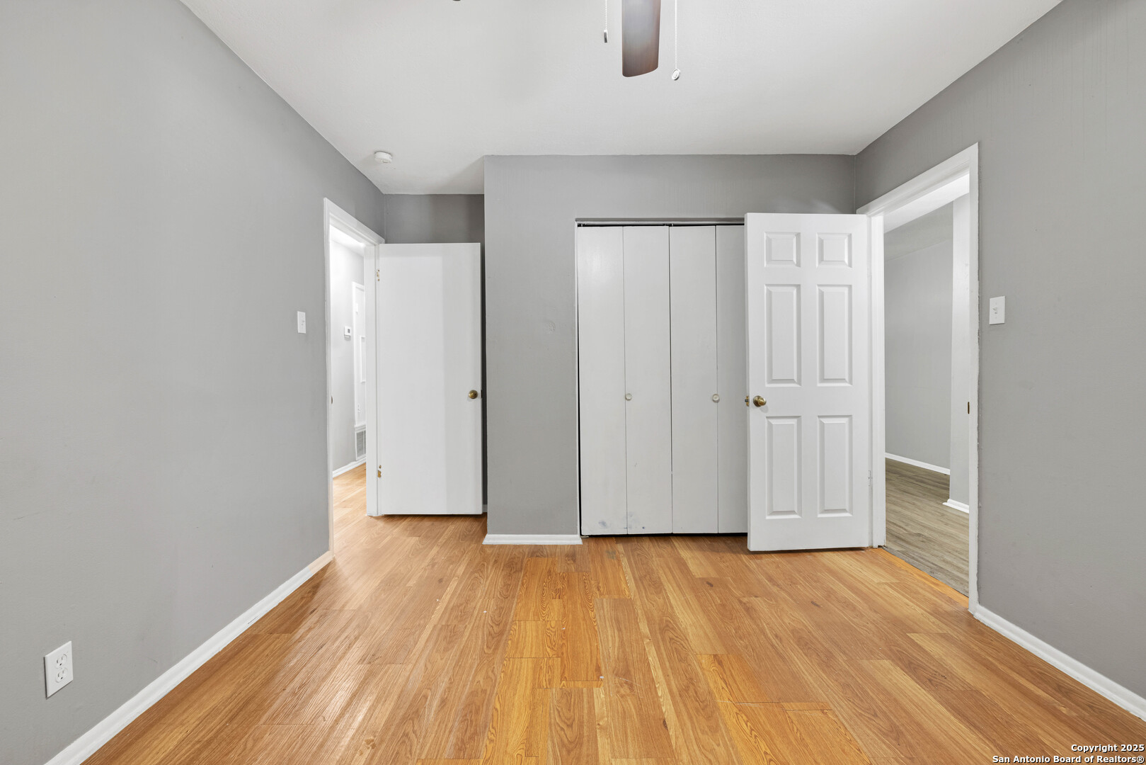 6012 Evers Road Leon Valley, TX 78238 - Photo 3 of 17 a view of empty room with wooden floor