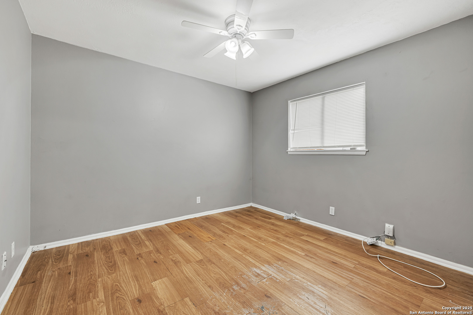 6012 Evers Road Leon Valley, TX 78238 - Photo 4 of 17 wooden floor in a room with a window