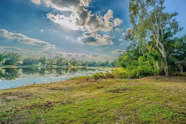 a view of a lake with a big yard