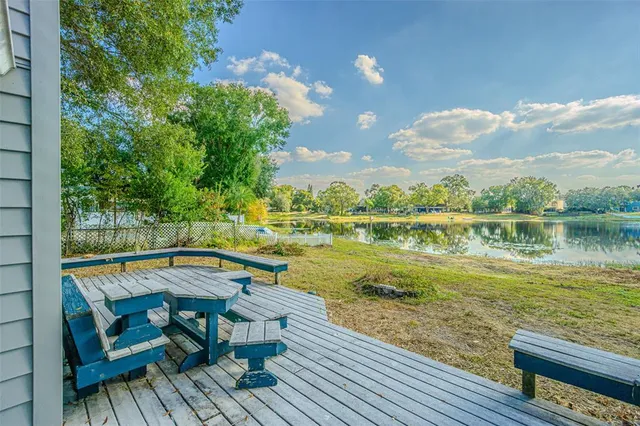 a view of a lake with outdoor seating
