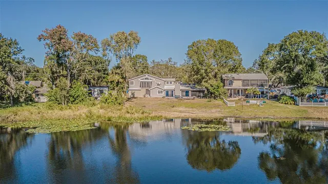 a swimming pool view with a lake view