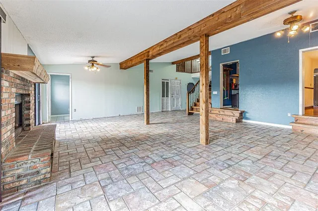 a view of a big room with windows