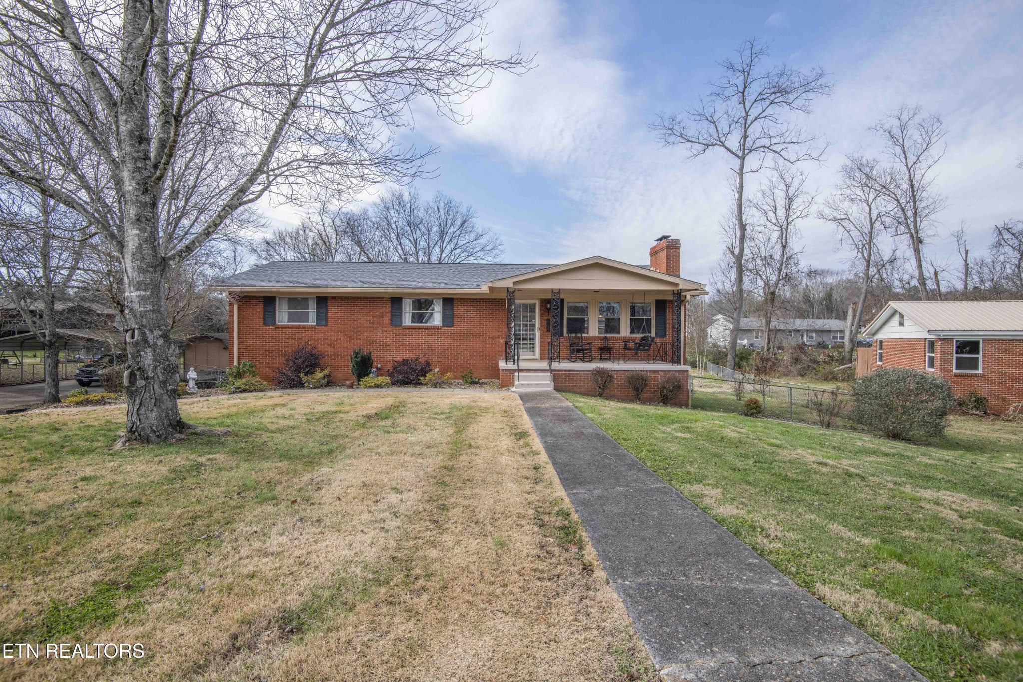 5409 Inwood Road Northwest Knoxville, TN 37921 - Photo 1 of 47 a front view of a house with a yard