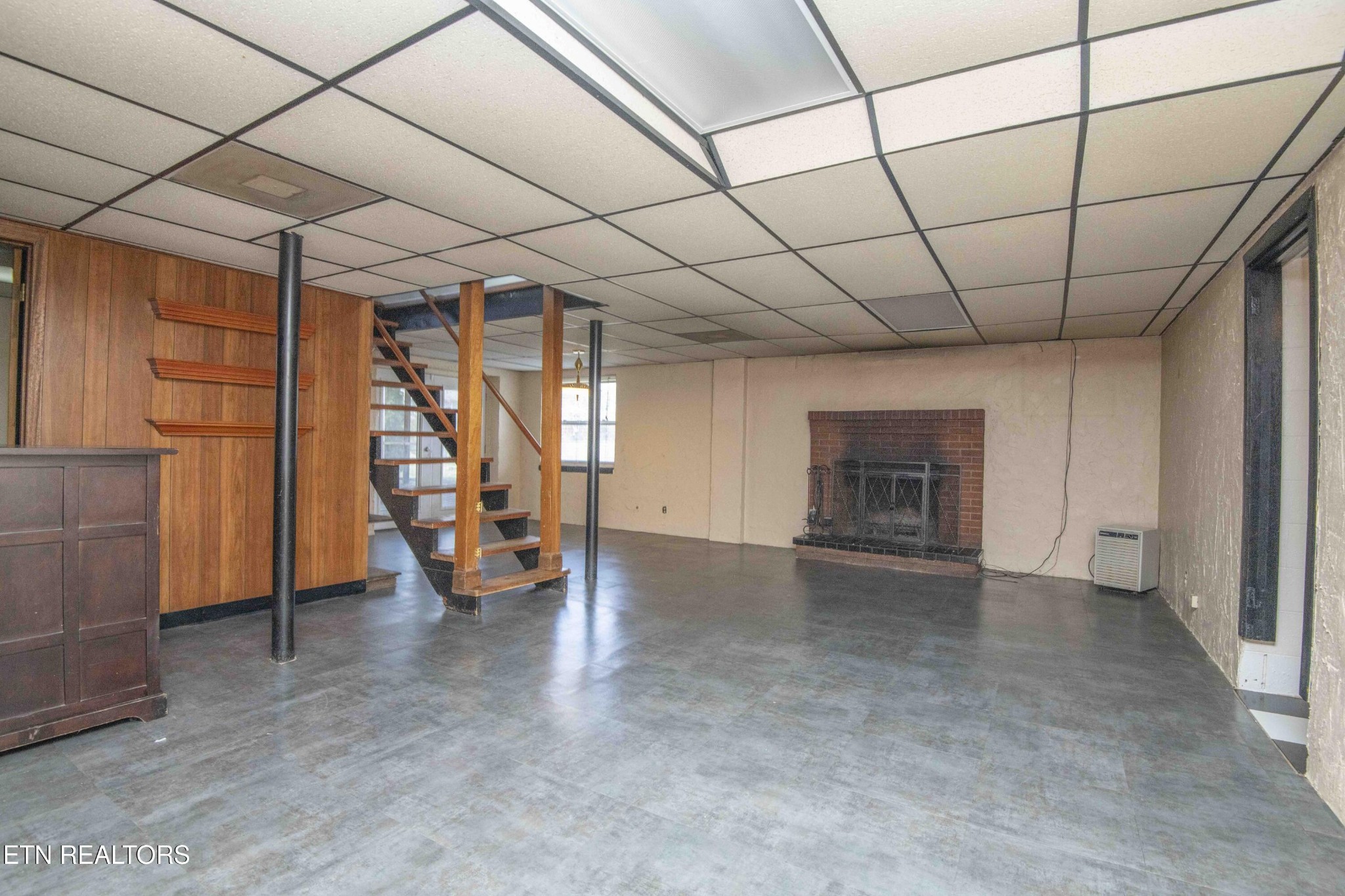 5409 Inwood Road Northwest Knoxville, TN 37921 - Photo 28 of 47 a view of empty room with wooden floor and fireplace