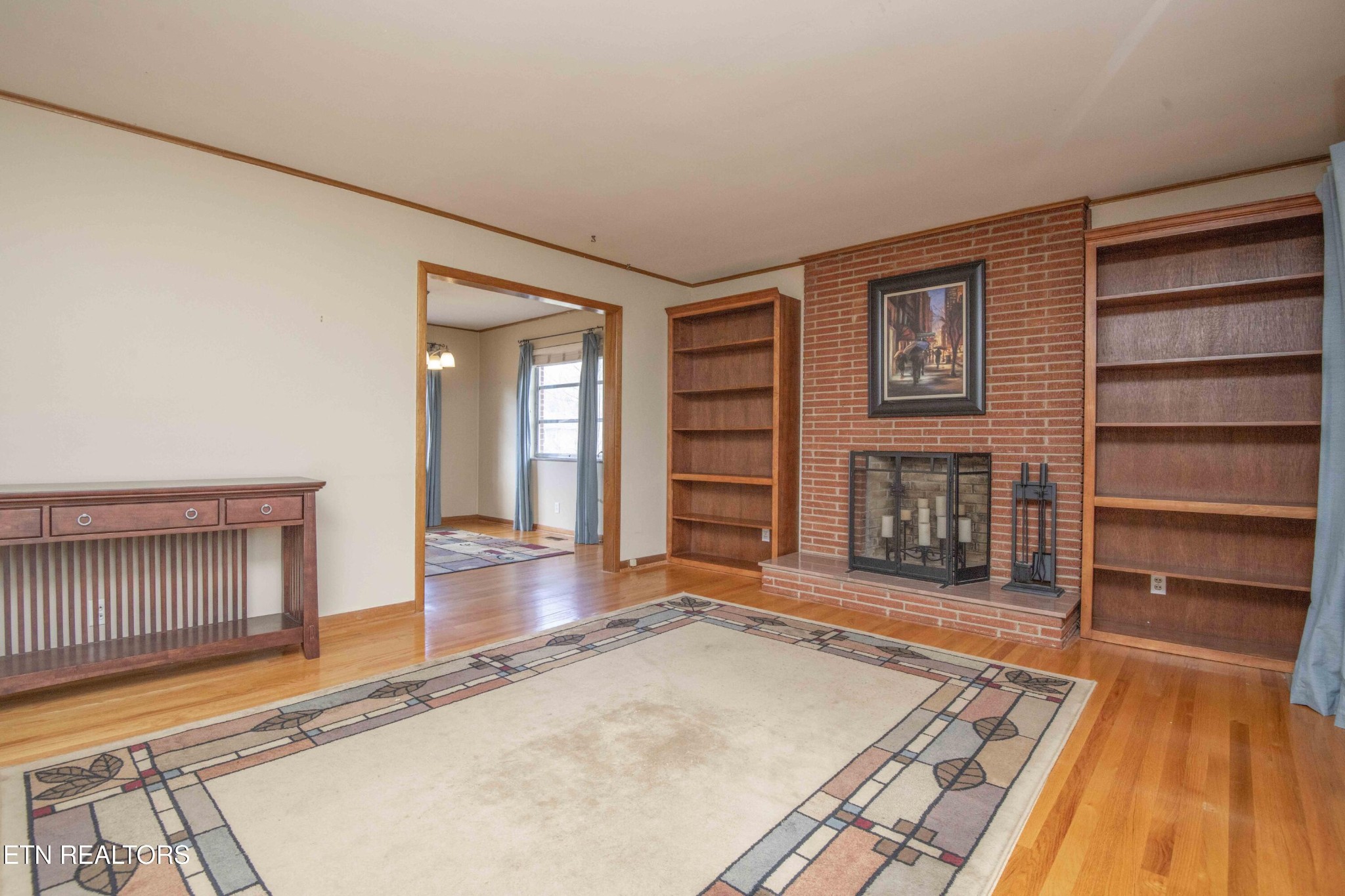 5409 Inwood Road Northwest Knoxville, TN 37921 - Photo 6 of 47 a living room with a fireplace and a rug