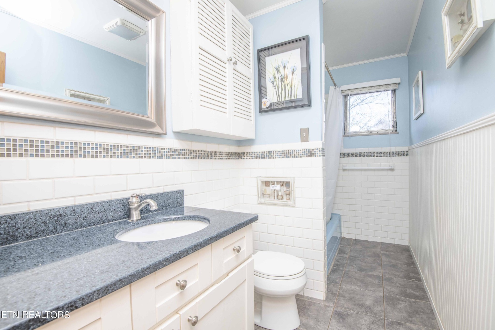5409 Inwood Road Northwest Knoxville, TN 37921 - Photo 8 of 47 a bathroom with a granite countertop toilet sink and mirror
