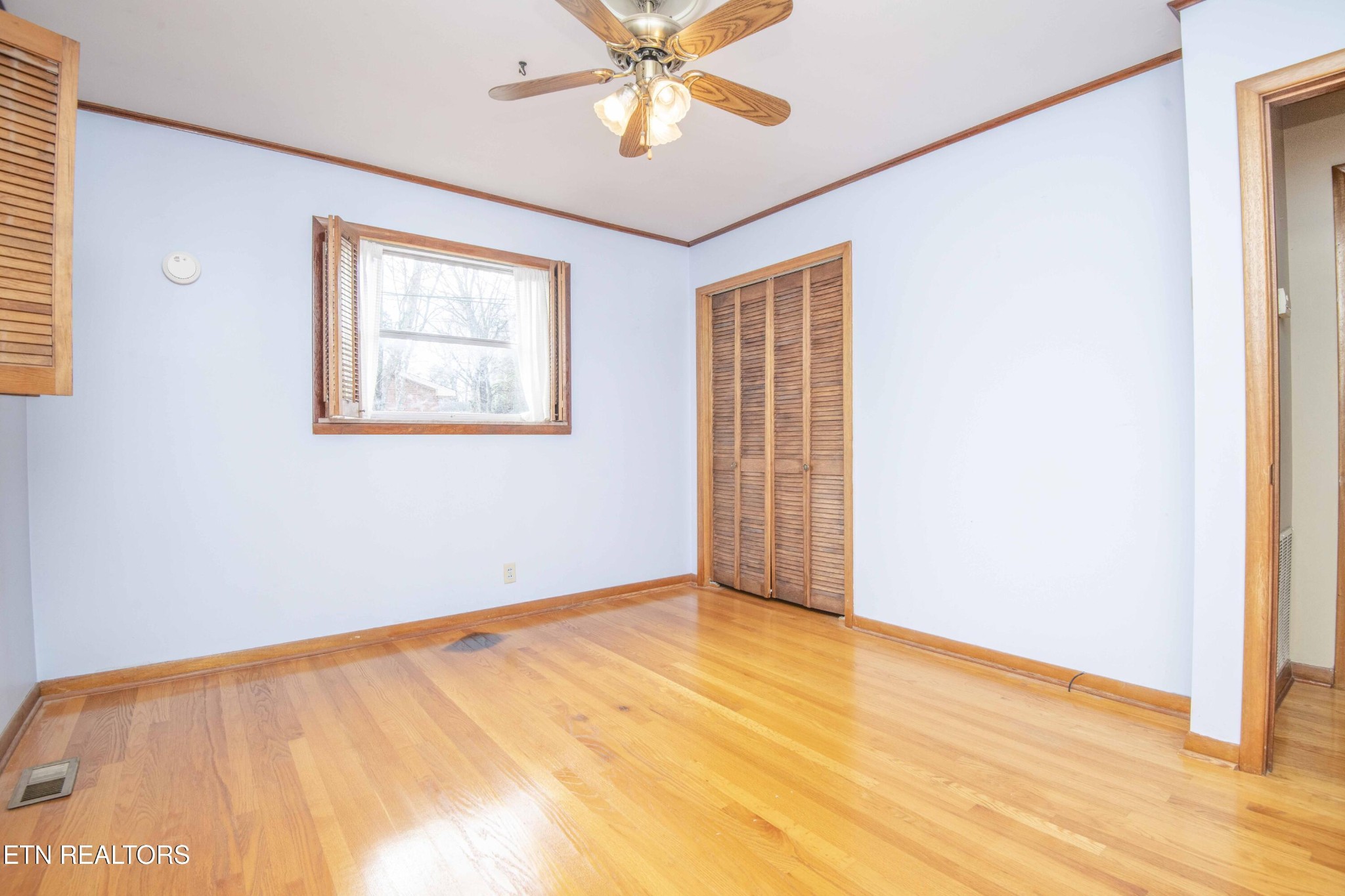5409 Inwood Road Northwest Knoxville, TN 37921 - Photo 10 of 47 a view of an empty room with window and wooden floor